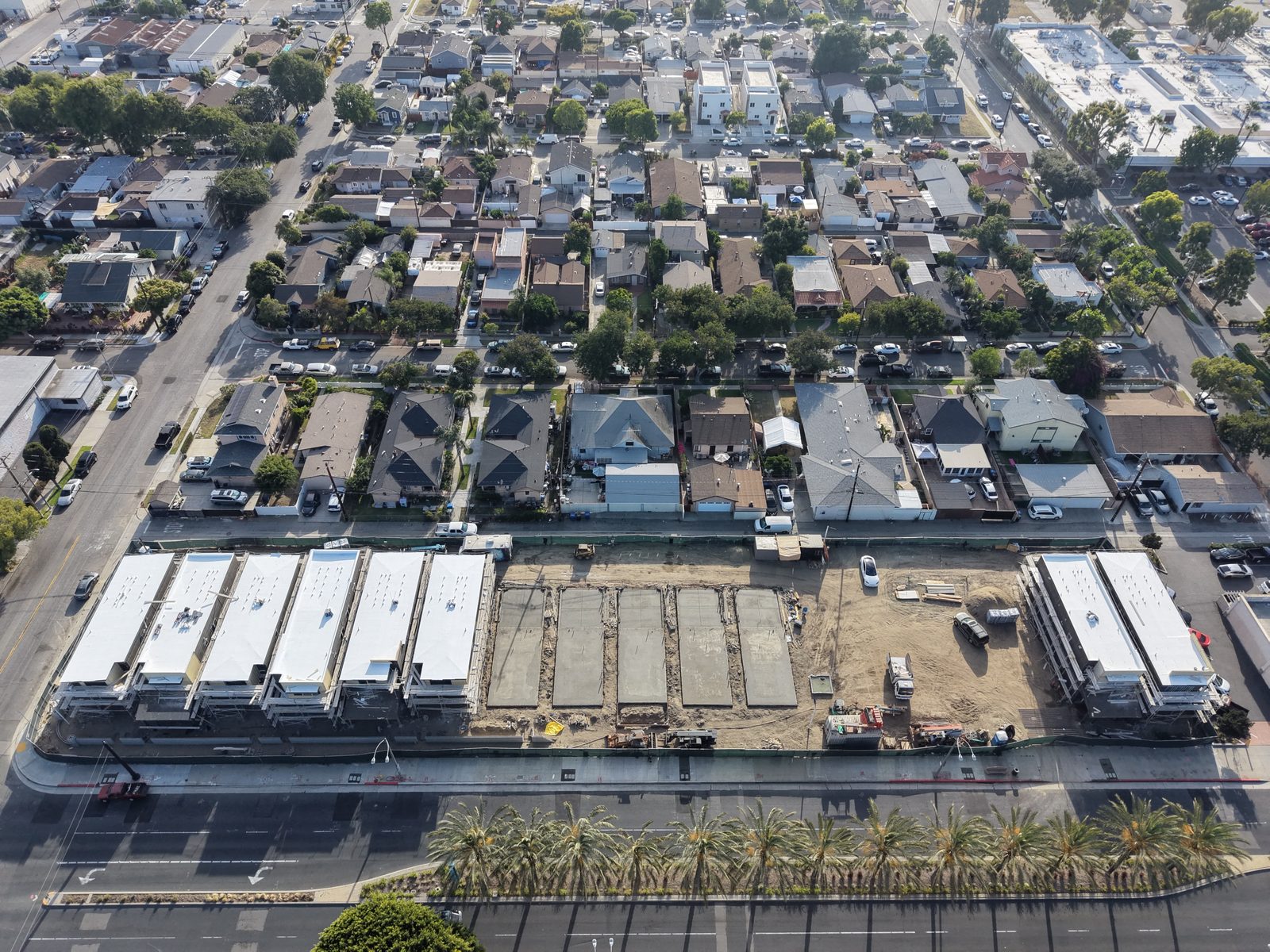 Entrada aerial construction progress over the 17-home site along Paramount Boulevard, June 2026