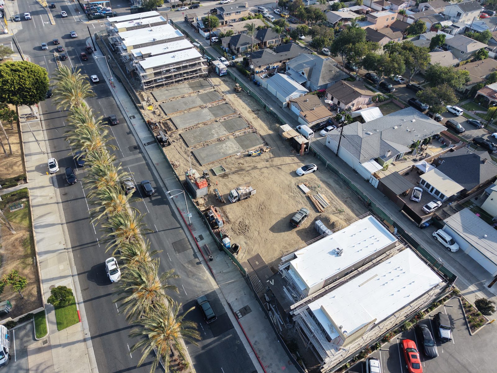 Entrada aerial construction progress showing foundations and framing, June 2026