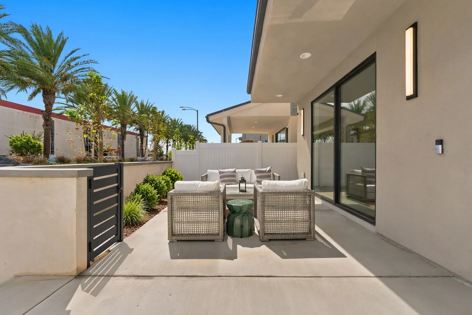 A private fenced front patio